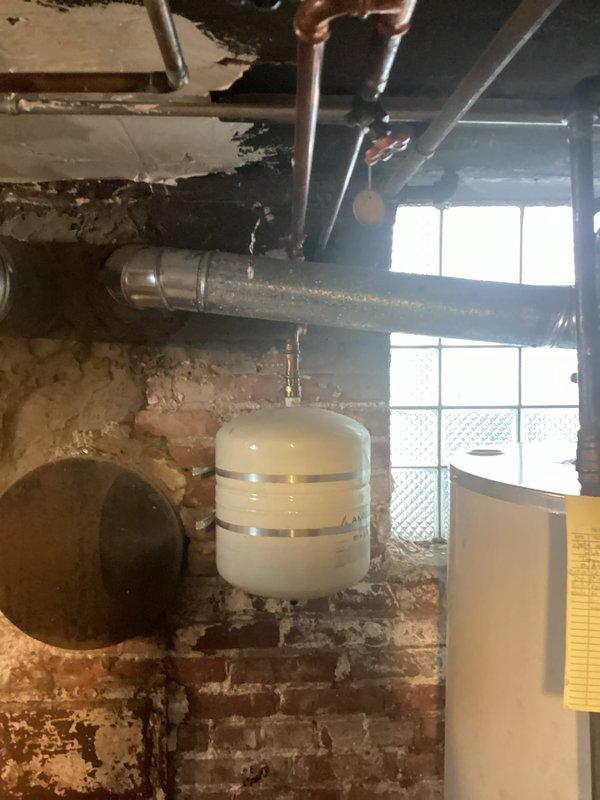 Performed scheduled maintenance on tanked water heater system. Inspected expansion tank, copper supply lines, and ventilation components. All connections secure with proper function verified during service visit.