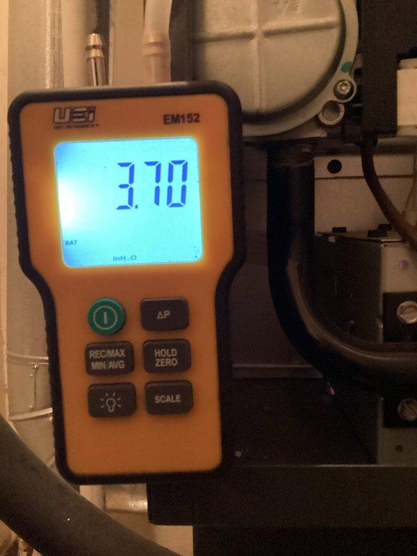 Performed routine heating tune-up, inspecting electrical components with UEi G2 Phoenix PRO DL379 multimeter and measuring gas pressure at 3.70 inH₂O with UEI EM152 manometer. System operation verified within manufacturer specifications.