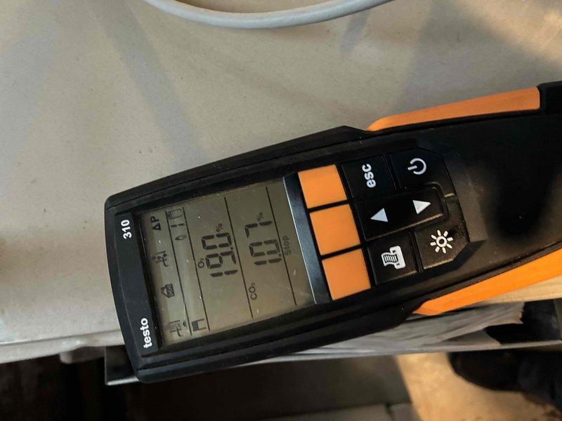 Performed routine heating maintenance on aging system (10+ years). Conducted combustion analysis using Testo 310 analyzer to verify proper operation parameters. Inspected internal components including mounting brackets and copper lines, noting some dust accumulation that was cleaned during service.