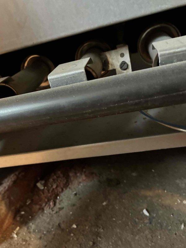 Performed routine heating maintenance on aging system (10+ years). Conducted combustion analysis using Testo 310 analyzer to verify proper operation parameters. Inspected internal components including mounting brackets and copper lines, noting some dust accumulation that was cleaned during service.