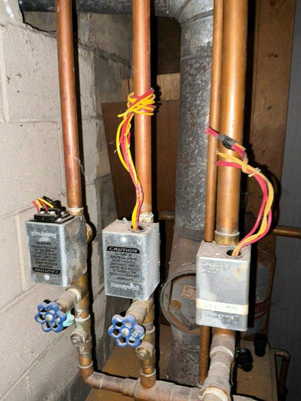 Conducted an assessment for conversion from existing boiler system to forced air gas system. Current installation features an aging boiler with visible rust, multiple zone valves, and copper distribution piping. Customer is planning to have gas service installed to the property and is obtaining multiple estimates for the conversion project.