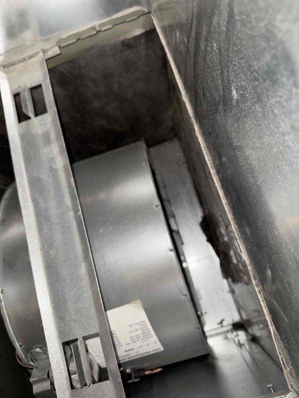 Responded to no heat service call where pilot light would not ignite. Inspected furnace blower wheel assembly and found evidence of condensation within the housing. Cleaned components, relit pilot light, and verified proper system operation.