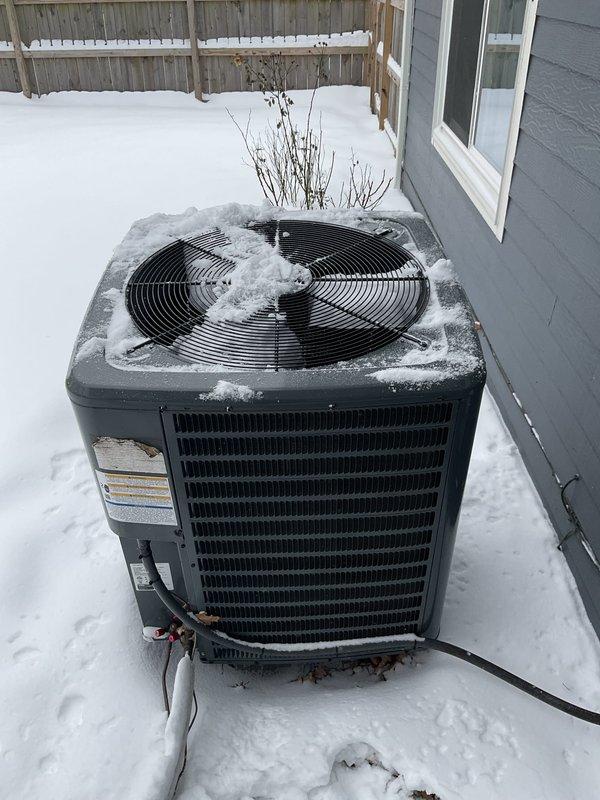 Responded to no-heat call for heat pump system. Diagnosed snow accumulation on outdoor unit restricting airflow and preventing proper defrost cycle operation. Cleared snow from outdoor unit, inspected electrical components and connections, and verified proper system operation after restoration. Heat successfully restored to residence.