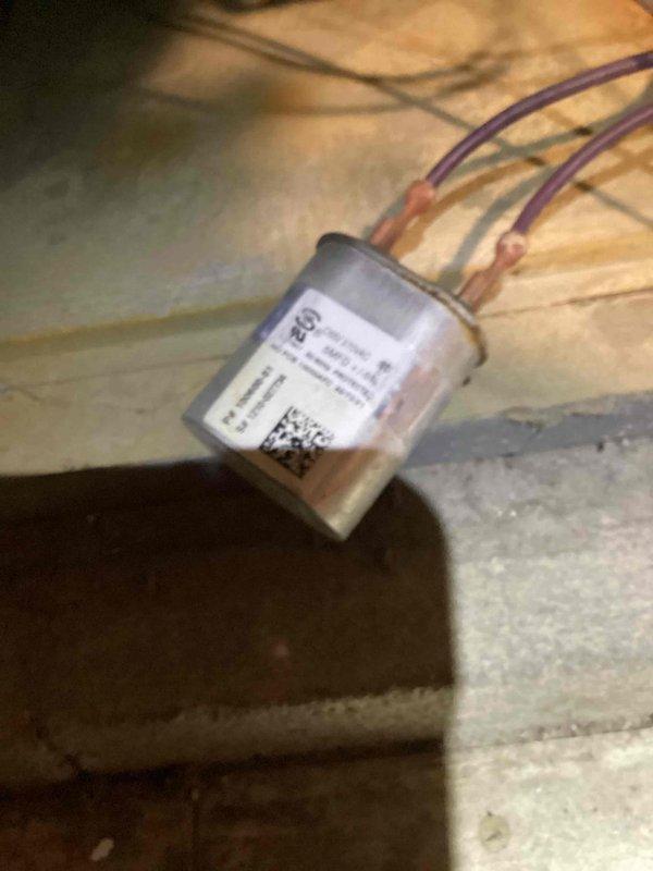 Performed scheduled heating tune-up service, inspecting circuit board connections and wiring in control system. Checked electronic sensor functionality with purple wire connections. All components operating correctly with no issues found.