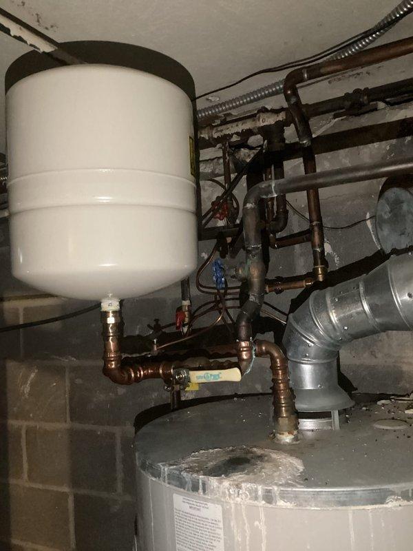 Performed courtesy inspection of water heater system and expansion tank. Checked all copper pipe connections, valves, and fittings for proper installation and functionality. Verified expansion tank mounting and pressure settings to ensure optimal operation of the system.