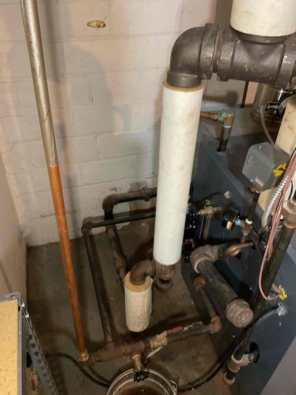 Performed scheduled maintenance on boiler system. Located and repaired leaking copper pipe junction in basement utility area that was causing water accumulation beneath piping. Inspected circulation pump and pressure gauge on main vertical line; both components functioning properly with no issues detected.