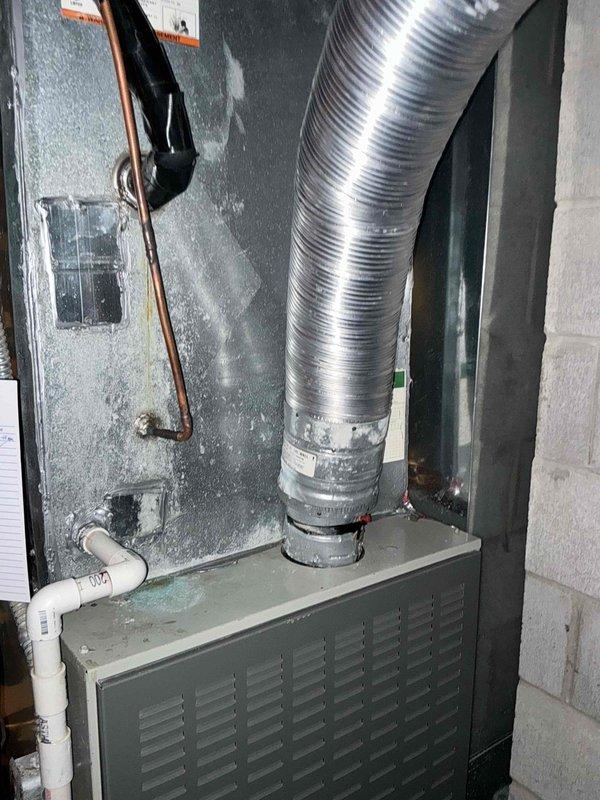 Conducted assessment of older Trane furnace system in basement utility room. Unit still operational with good heat output but showing signs of age-related wear. Noted favorable installation conditions with easy access for replacement. Documented existing setup including furnace, ductwork configuration, and connection points to assist with replacement options.