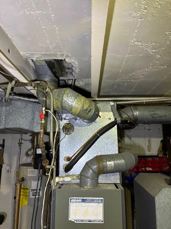 Completed assessment of aging furnace system located in basement utility area with good accessibility. Presented customer with multiple replacement options for both furnace-only and complete system upgrades. System features extensive metal ductwork with visible wear on components and connections.