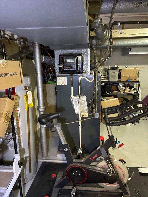 Completed assessment of aging furnace system located in basement utility area with good accessibility. Presented customer with multiple replacement options for both furnace-only and complete system upgrades. System features extensive metal ductwork with visible wear on components and connections.