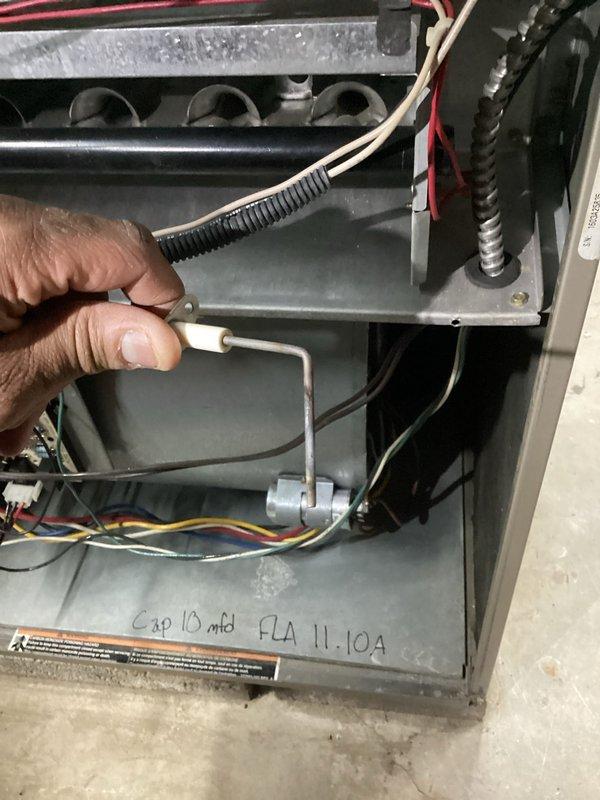 Performed annual heating system tune-up on furnace unit. Inspected internal components including heat exchangers, electrical connections, and capacitor (10 mfd, FLA 11.10A). Conducted performance testing with Testo analyzer, recording temperature readings of 302.7°F and 138°F at supply/return ducts to verify proper operation.