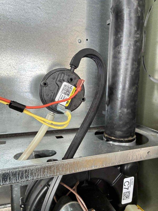 Performed routine monthly heating maintenance service on HVAC system. Inspected control board components including White-Rodgers F60-1205 circuit board, capacitors, and terminal connections. Checked pressure switch functionality and verified proper connection of control wiring and pressure hose to ensure safe system operation.