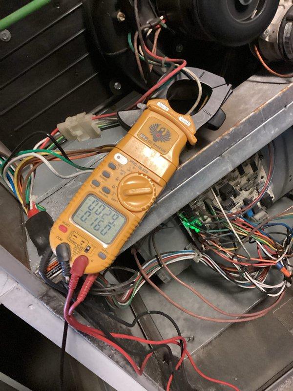 Performed scheduled heating maintenance on furnace system. Conducted electrical diagnostics with clamp meter to verify proper component operation. Inspected ignition assembly and heat exchanger for proper functionality. Identified pet dander accumulation in ductwork as source of odor from vent and addressed uneven heating distribution in room.