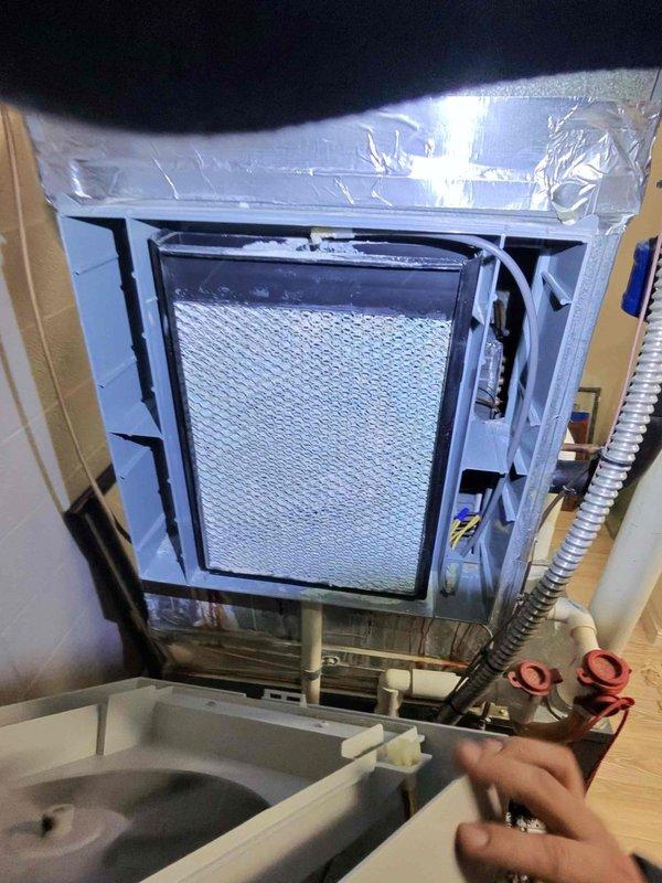 Returned to residence to replace defective gas valve under warranty. Accessed HVAC unit, removed existing valve, and installed new replacement component. Inspected drainage system and verified proper operation after installation. System functioning normally upon completion.