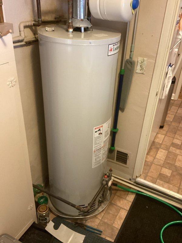 Completed fulfillment of MVP Water Heater installation in utility area. Installed Lochinvar water heater with expansion tank, connected copper and PVC piping, and ensured proper venting. All connections verified secure with no leaks observed.