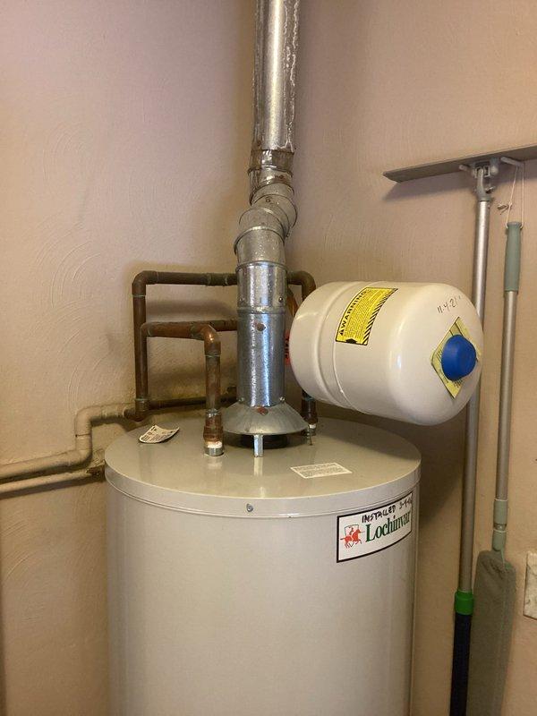 Completed fulfillment of MVP Water Heater installation in utility area. Installed Lochinvar water heater with expansion tank, connected copper and PVC piping, and ensured proper venting. All connections verified secure with no leaks observed.