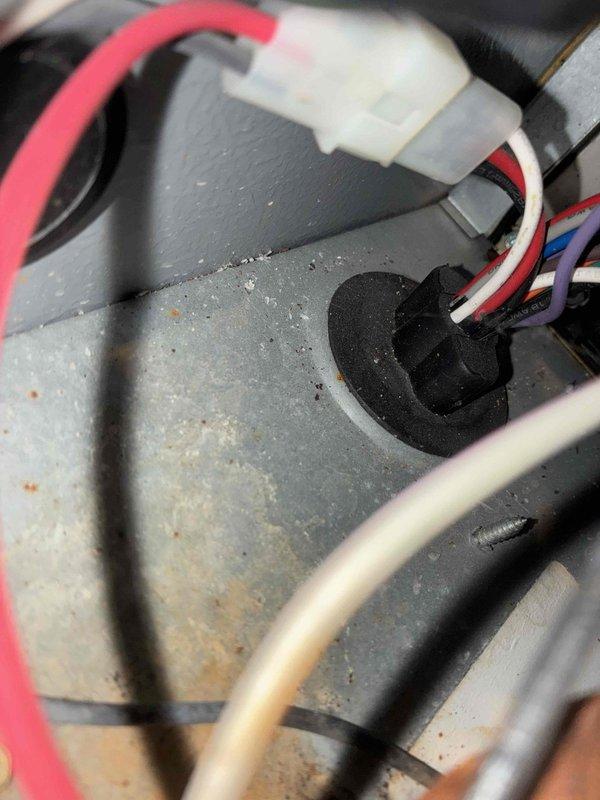 Performed routine maintenance on 7-year-old furnace per maintenance agreement. Discovered significant corrosion on heat exchanger pipe connections and inspected electrical wiring, noting several wires passing through a grommet with normal wear. Documented findings with photos and advised customer of corrosion concerns requiring future attention.