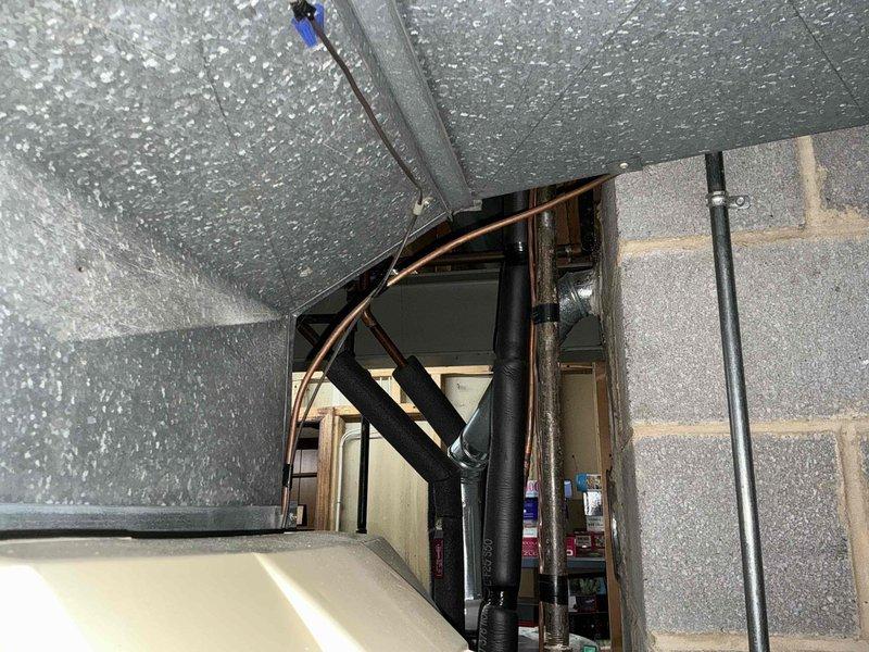 Conducted full system replacement estimate for aging HVAC equipment. Inspected mechanical room with limited clearance between equipment and concrete block wall. Documented existing installation including insulated ductwork, piping configuration, and electrical connections to determine optimal replacement options.