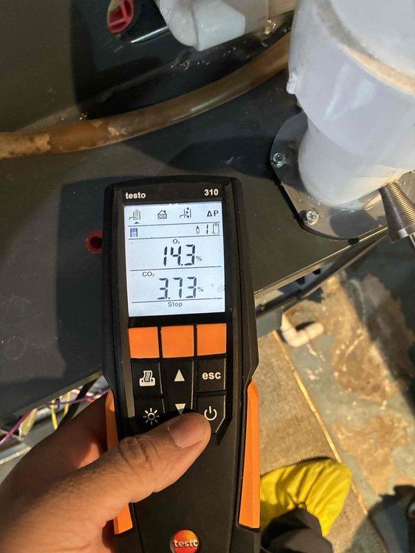 Performed routine heating tune-up service including combustion analysis using Testo 310 device (readings: 14.3% CO₂, 373 ppm) and replaced air filter with new filter media. System now operating within manufacturer specifications.
