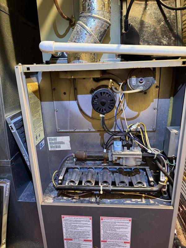 Responded to no heat complaint with thermostat showing 61°F despite 68°F setpoint. Diagnostic testing revealed significant temperature differential (65°F supply, 75°F return) indicating heat exchanger failure in aging furnace. Recommended complete system replacement due to cracked heat exchanger posing safety hazard and unit exceeding expected service life.