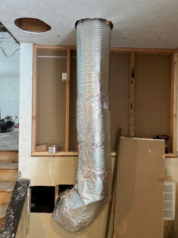 Completed relocation and re-insulation of flexible ductwork in crawl space area, securing all seams with reflective tape to ensure proper thermal efficiency. Successfully wired low voltage connections to HVAC unit according to manufacturer specifications and verified system operation.