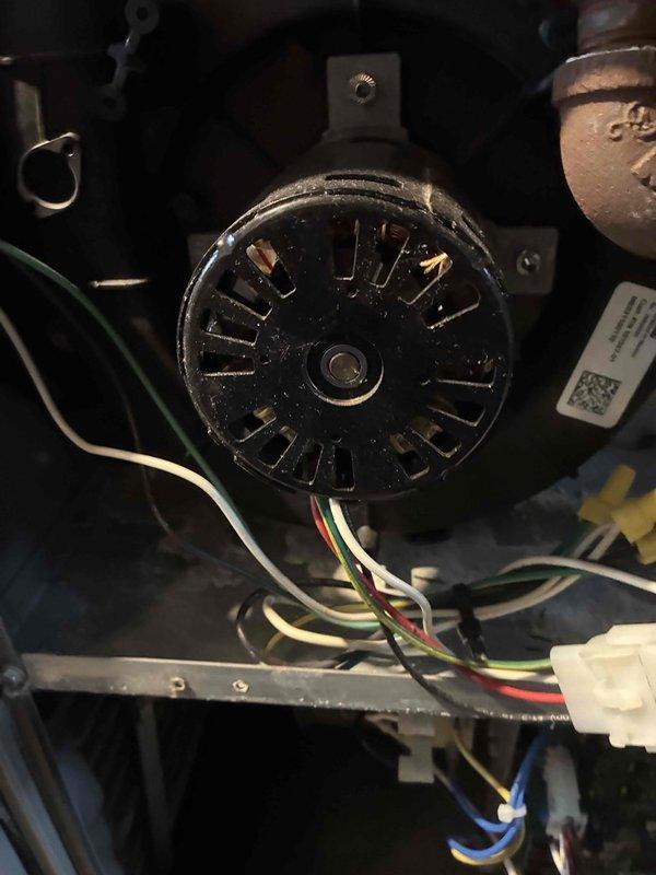 Performed monthly heating maintenance service on HVAC system. Conducted electrical diagnostics using Fieldpiece SC260 clamp meter, confirming proper voltage reading of 29.5. Inspected blower motor assembly, verifying all wiring connections (green, white, red, and blue) were secure and properly terminated.