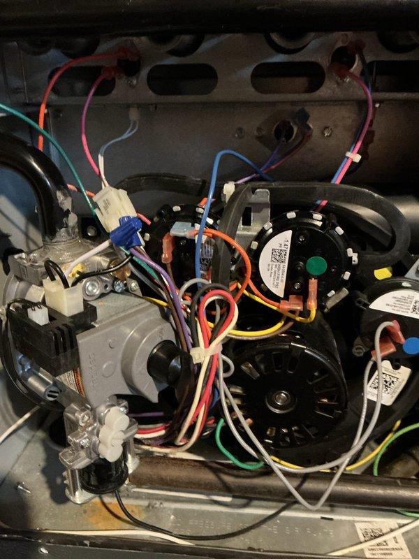 Performed warranty service to replace defective gas valve on heating system. Removed access panel, disconnected electrical connections and supply lines, installed new OEM gas valve, and verified proper ignition sequence with all four burners functioning correctly. System now operating within manufacturer specifications.