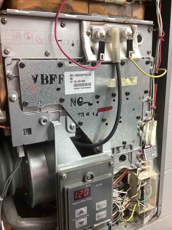 Performed water heater maintenance and inspected slow draining bathroom fixtures. Diagnosed diverter valve issue causing improper water flow transition between bath spout and shower function. Recommended service for both the drainage system and diverter valve mechanism to restore proper functionality.