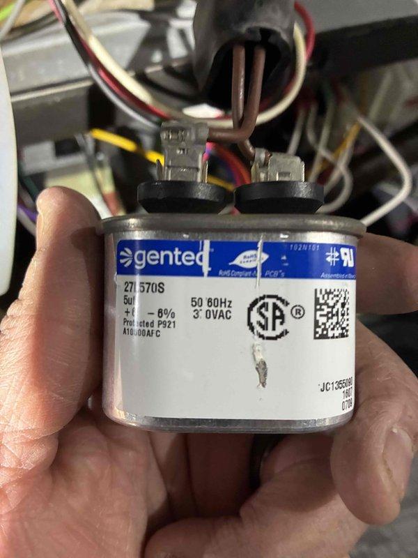 Performed heating system maintenance service including combustion efficiency testing with Testo 310 analyzer (measured 105.2°F temperature with 7.7% O₂ levels). Inspected and verified proper operation of the 370VAC Genteq capacitor (model 271 570S) connected to the system motor. All components functioning within normal parameters.