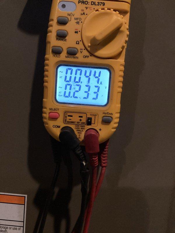 Performed monthly heating maintenance service on residential HVAC system. Conducted electrical diagnostics using PRO:DL379 multimeter, measuring amperage (0.044A) and voltage (0.233V) to verify proper operation. Inspected Aprilaire furnace components and drainage system, confirming all systems functioning within specifications.