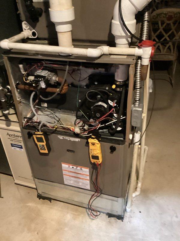 Performed monthly heating maintenance service on residential HVAC system. Conducted electrical diagnostics using PRO:DL379 multimeter, measuring amperage (0.044A) and voltage (0.233V) to verify proper operation. Inspected Aprilaire furnace components and drainage system, confirming all systems functioning within specifications.