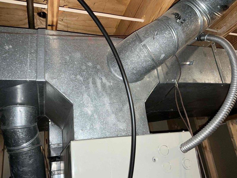 Conducted assessment for electric-to-gas HVAC system conversion. Inspected current attic installation including metal ductwork, connections, and existing unit placement. Evaluated crawlspace conditions to determine feasibility of gas line installation while customer awaits city approval for gas service connection.
