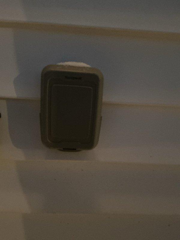 Responded to customer complaint regarding thermostat displaying "low batteries" and "replace sensor" messages. Inspected Carrier digital thermostat showing normal temperature (70°F) and humidity (41%) readings. Replaced batteries and tested system functionality, confirming proper operation with no further error messages.