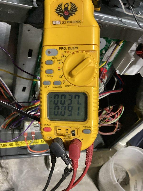 Performed routine furnace maintenance including electrical diagnostic testing with UEi G2 PHOENIX PRO multimeter showing readings within normal parameters. Conducted combustion analysis using Testo analyzer which displayed readings of 10.29% and 64, indicating proper furnace operation and acceptable combustion efficiency.