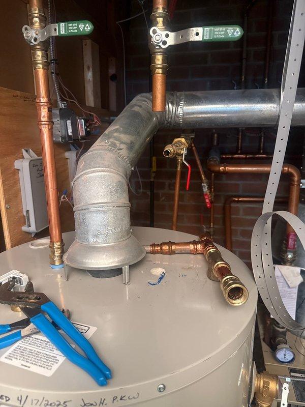 Returned to premises to replace water heater fill tube as scheduled. Verified proper installation and connection of Bradford White water heater system, including expansion tank, copper supply lines, and ventilation duct. All components functioning correctly after service completion.