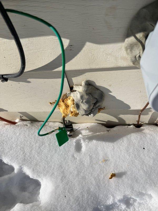 Inspected exterior electrical panel due to customer complaint of ice buildup following recent panel replacement. Verified proper sealing around service entrance with weatherproof putty. Confirmed all connections are secure and properly insulated with no evidence of water intrusion into the main housing. Explained to customer that condensation pattern is normal during winter conditions and not related to panel installation.