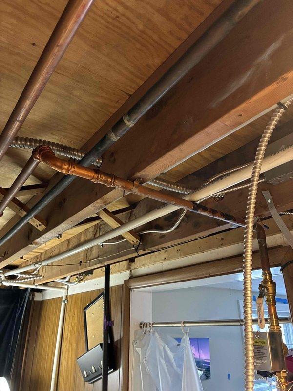 Performed warranty service on boiler system, including complete refill and bleeding procedure to remove air from the system. Inspected copper piping and associated fittings in utility area for potential replacement needs. System was successfully restored to proper operation with no parts requiring immediate replacement.