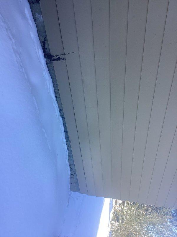 Conducted site inspection for generator installation. Evaluated existing electrical panel and exterior mounting location. Photos documented current soffit condition and utility connections in crawl space for proper generator placement and planning.