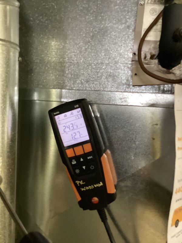 Performed routine heating system maintenance on a furnace unit. Conducted diagnostic testing with digital analyzer showing readings of 243.1 and 12.7, and verified all electrical connections and components were functioning properly. System is now operating correctly with no issues identified.