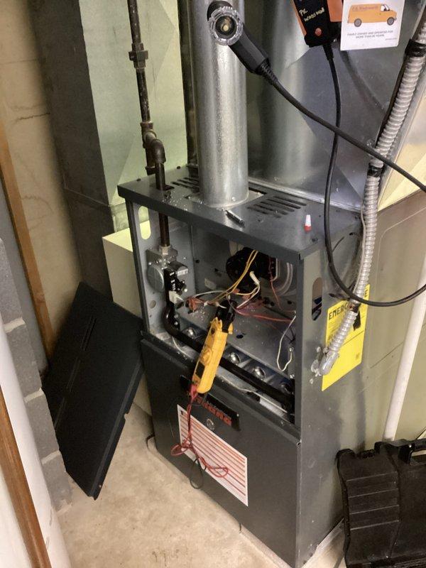 Performed routine heating system maintenance on a furnace unit. Conducted diagnostic testing with digital analyzer showing readings of 243.1 and 12.7, and verified all electrical connections and components were functioning properly. System is now operating correctly with no issues identified.