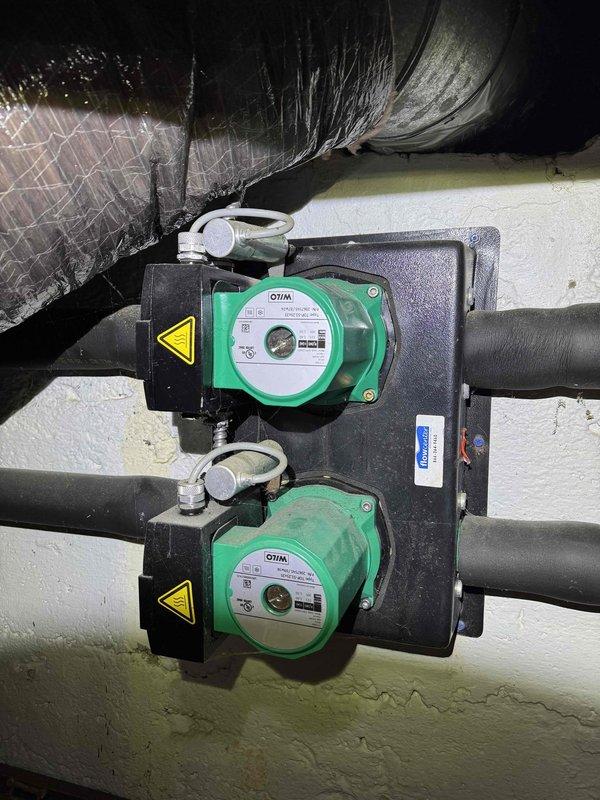 Responded to customer's no-heat complaint where emergency heat mode was being used. Inspection revealed issues with the circulation system, specifically with the WILO pumps on the hydronic manifold. Serviced the blower motor assembly and verified proper operation of the control board, restoring normal heating functionality without requiring emergency heat mode.