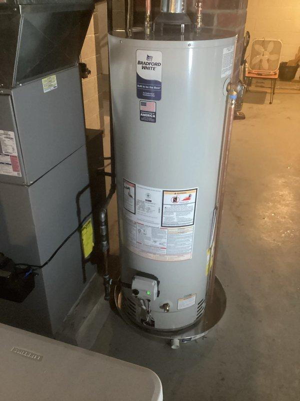 Replaced 40-gallon tall Bradford White water heater in residential mechanical room. Installation included all required code upgrades with proper copper pipe connections, expansion tank mounting, and ventilation system. Work completed with all safety specifications met and system tested for proper functionality.
