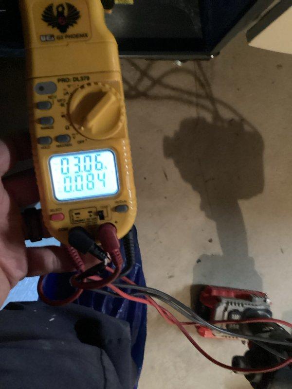 Performed monthly heating system maintenance service including combustion analysis with Testo 310 showing 96.6°F temperature and 6.1% oxygen concentration. Conducted electrical diagnostic testing using UEi PRO DL379 multimeter, measuring voltage readings of 0.306V and 0.084V at component terminals to verify proper operation.