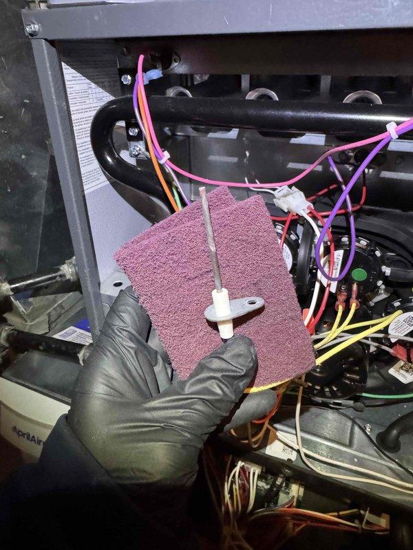 Performed scheduled annual maintenance on furnace system. Inspected PVC flue pipe connections and clamps for proper sealing. Cleaned flame sensor with abrasive pad and checked electrical connections throughout system to ensure proper functionality.