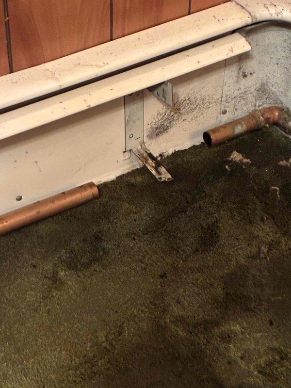 Returned to residence to address hydronic heating system issues. Successfully bled air from the system and repaired a corroded finn pipe that showed significant oxidation. System is now operating properly with no leaks observed.