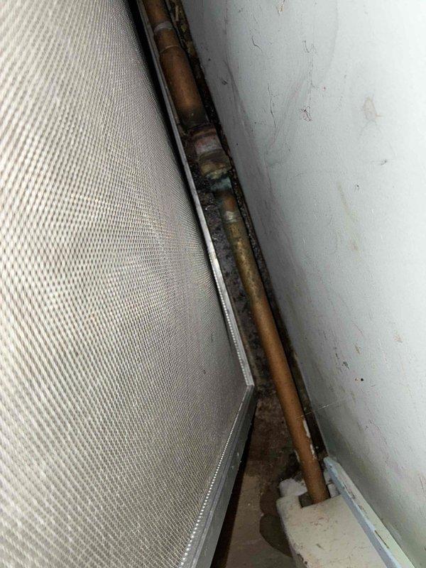 Returned to residence to address hydronic heating system issues. Successfully bled air from the system and repaired a corroded finn pipe that showed significant oxidation. System is now operating properly with no leaks observed.
