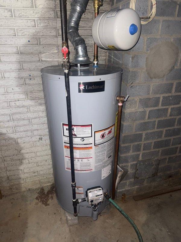 Performed scheduled maintenance on Lochinvar tanked water heater. Inspected unit, connections, expansion tank, and pressure relief valve. All components functioning properly with no leaks or issues observed.