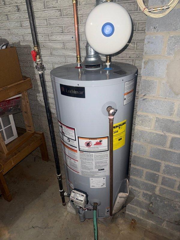 Performed scheduled maintenance on Lochinvar tanked water heater. Inspected unit, connections, expansion tank, and pressure relief valve. All components functioning properly with no leaks or issues observed.