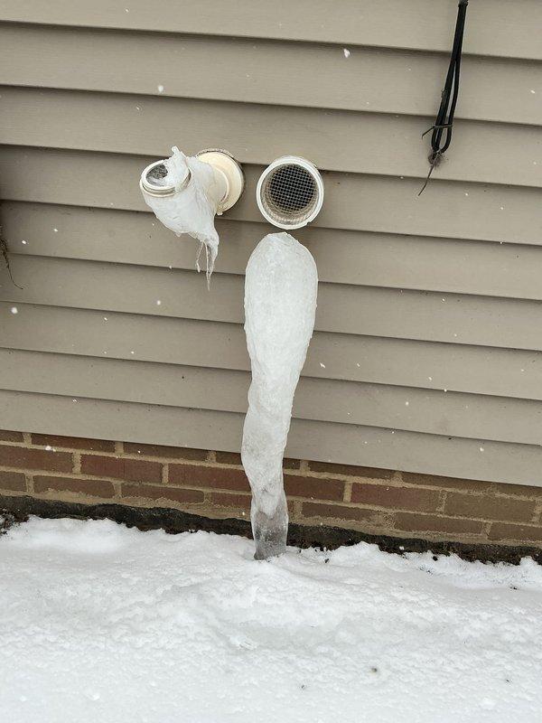 Responded to no-heat call for recently installed 6-month-old furnace. Inspection revealed severe ice formation on exterior PVC exhaust venting, with icicles extending several feet from the termination point. Cleared ice blockage from vent pipes to restore proper exhaust flow and system operation.