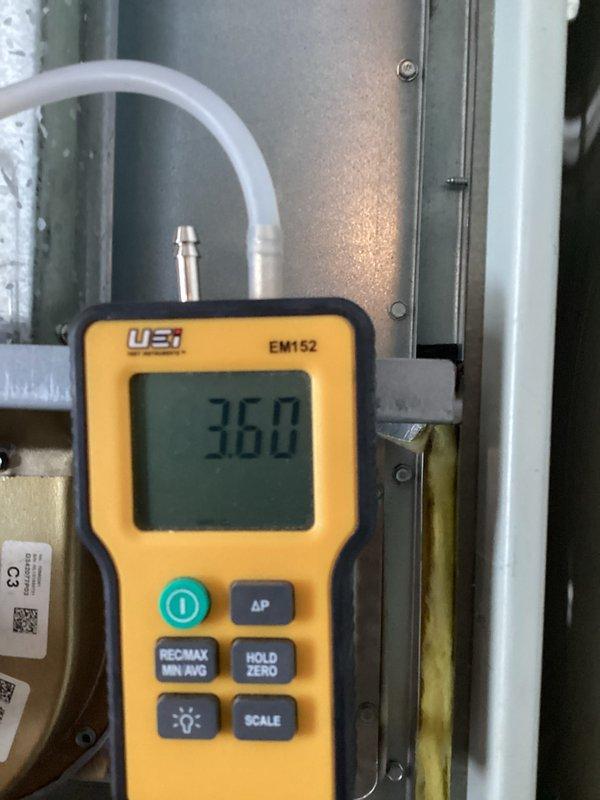 Performed comprehensive maintenance on aging heating system (10+ years old). Conducted full inspection of furnace interior components, revealing all connections and wiring intact. Measured static pressure with UEi EM152 gauge showing 36.0 reading, indicating system is operating within acceptable parameters despite age. Addressed intermittent odor issue by cleaning internal components and recommending regular filter replacement schedule.