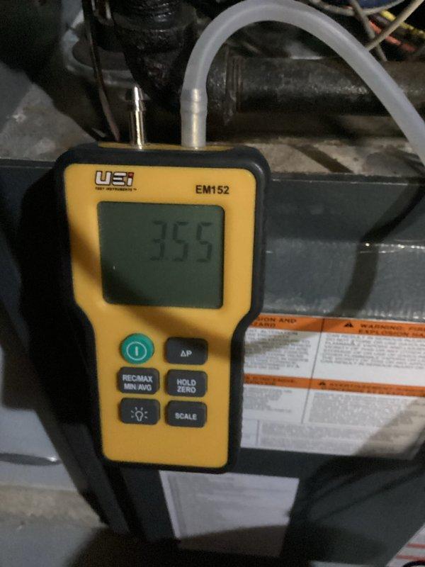 Completed heating maintenance on aging system (10+ years). Performed electrical diagnostic testing using UEi EM152 probe measuring device (reading of 35.5) and UEi PRO: DL379 clamp meter (readings of 208V). All measurements within acceptable parameters, system functioning properly after service.